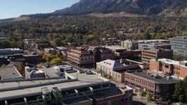 5.7K aerial stock footage of a brick office building at quiet intersection seen while descending in Boulder, Colorado Aerial Stock Footage | DX0001_001906