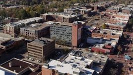 5.7K aerial stock footage approach a brick office building and ascend in Boulder, Colorado Aerial Stock Footage | DX0001_001909