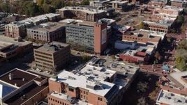 5.7K aerial stock footage fly away from a brick office building and descend in Boulder, Colorado Aerial Stock Footage | DX0001_001910