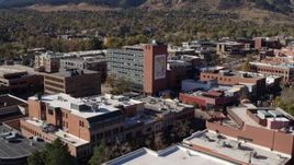 5.7K aerial stock footage of flying by a brick office building in Boulder, Colorado Aerial Stock Footage | DX0001_001911