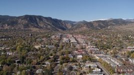 5.7K aerial stock footage fly away from and flyby Boulder, Colorado with mountains in background Aerial Stock Footage | DX0001_001921
