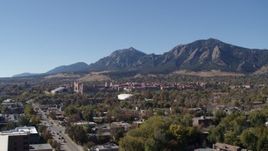 5.7K aerial stock footage flyby the University of Colorado Boulder during ascent, with Green Mountain in background Aerial Stock Footage | DX0001_001927