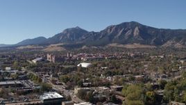 5.7K aerial stock footage passing the University of Colorado Boulder and Green Mountain in distance Aerial Stock Footage | DX0001_001931