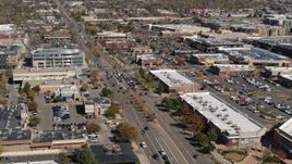 5.7K aerial stock footage approach a strip mall beside a wide street in Boulder, Colorado Aerial Stock Footage | DX0001_001950