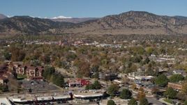 5.7K aerial stock footage of passing the mountain town of Boulder, Colorado seen from apartment buildings Aerial Stock Footage | DX0001_001954