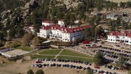 5.7K aerial stock footage of passing by the historic Stanley Hotel in Estes Park, Colorado Aerial Stock Footage | DX0001_001958