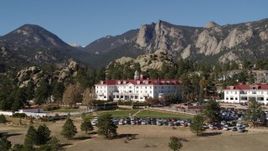 5.7K aerial stock footage of the historic Stanley Hotel in Estes Park, Colorado, mountains in background Aerial Stock Footage | DX0001_001962