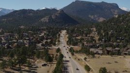 5.7K aerial stock footage of cars on a road through the town of Estes Park, Colorado Aerial Stock Footage | DX0001_001975