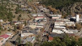 5.7K aerial stock footage of shops lining the road through Estes Park, Colorado seen during descent Aerial Stock Footage | DX0001_001987