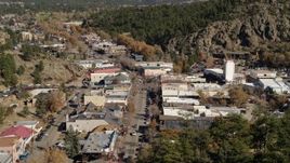 5.7K aerial stock footage a reverse view of shops on road through Estes Park, Colorado Aerial Stock Footage | DX0001_001992