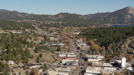 5.7K aerial stock footage flyby shops lining road through Estes Park, Colorado while descending Aerial Stock Footage | DX0001_001996