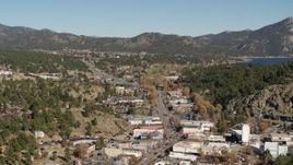 5.7K aerial stock footage flyby shops lining road through Estes Park, Colorado while ascending Aerial Stock Footage | DX0001_001997