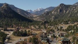 5.7K aerial stock footage of rural homes near rugged mountains in Estes Park, Colorado seen while ascending Aerial Stock Footage | DX0001_002002