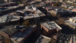 5.7K aerial stock footage of flying away from brick office buildings and shops in Fort Collins, Colorado Aerial Stock Footage | DX0001_002012