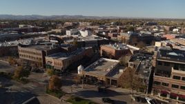 5.7K aerial stock footage pass a row of brick office buildings and shops in Fort Collins, Colorado Aerial Stock Footage | DX0001_002016