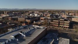 5.7K aerial stock footage fly away from a row of brick office buildings and shops in Fort Collins, Colorado Aerial Stock Footage | DX0001_002019