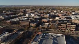 5.7K aerial stock footage approach a row of brick office buildings and focus on shops in Fort Collins, Colorado Aerial Stock Footage | DX0001_002020