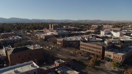 5.7K aerial stock footage of a reverse view of shops and office buildings in Fort Collins, Colorado Aerial Stock Footage | DX0001_002027