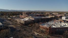 5.7K aerial stock footage approach and fly away from shops and office buildings in Fort Collins, Colorado Aerial Stock Footage | DX0001_002029