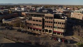 5.7K aerial stock footage of passing a brick office building in Fort Collins, Colorado Aerial Stock Footage | DX0001_002031