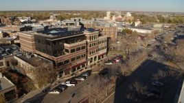 5.7K aerial stock footage of passing by a brick office building in Fort Collins, Colorado Aerial Stock Footage | DX0001_002032