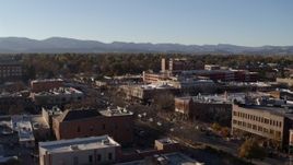 5.7K aerial stock footage flyby and away from a brick office buildings and shops in Fort Collins, Colorado Aerial Stock Footage | DX0001_002033