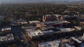 5.7K aerial stock footage of a view of office buildings, shops, parking garage in Fort Collins, Colorado Aerial Stock Footage | DX0001_002037