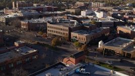 5.7K aerial stock footage of a view of brick office buildings and street level shops in Fort Collins, Colorado Aerial Stock Footage | DX0001_002044