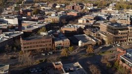 5.7K aerial stock footage reverse and flyby brick office buildings and street level shops in Fort Collins, Colorado Aerial Stock Footage | DX0001_002047