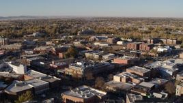 5.7K aerial stock footage of passing by several brick office buildings and street level shops in Fort Collins, Colorado Aerial Stock Footage | DX0001_002049