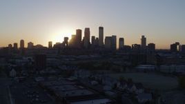 5.7K aerial stock footage of passing the city's skyline as the sun rises in Downtown Minneapolis, Minnesota during ascent Aerial Stock Footage | DX0001_002068
