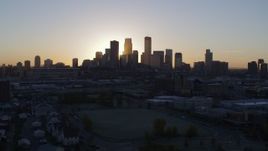 5.7K aerial stock footage a view of the city's skyline with the sunrise, seen during descent in Downtown Minneapolis, Minnesota Aerial Stock Footage | DX0001_002070