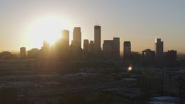 5.7K aerial stock footage a slow flyby while focusing on the city skyline at sunrise in Downtown Minneapolis, Minnesota Aerial Stock Footage | DX0001_002072