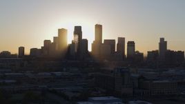 5.7K aerial stock footage focus on city skyline at sunrise during slow flyby and descent in Downtown Minneapolis, Minnesota Aerial Stock Footage | DX0001_002074