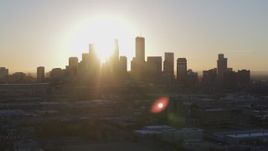5.7K aerial stock footage of the rising sun behind the city skyline in Downtown Minneapolis, Minnesota Aerial Stock Footage | DX0001_002079