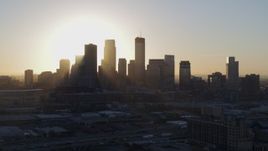 5.7K aerial stock footage ascend near the city's skyline at sunrise in Downtown Minneapolis, Minnesota Aerial Stock Footage | DX0001_002082