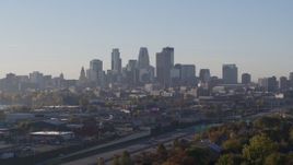 5.7K aerial stock footage slowly ascend and flyby the city's downtown skyline at sunrise in Downtown Minneapolis, Minnesota Aerial Stock Footage | DX0001_002093