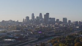 5.7K aerial stock footage slowly flyby the city's downtown skyline at sunrise during descent in Downtown Minneapolis, Minnesota Aerial Stock Footage | DX0001_002094