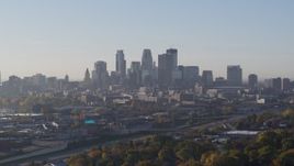5.7K aerial stock footage slowly flyby the city's downtown skyline at sunrise during ascent in Downtown Minneapolis, Minnesota Aerial Stock Footage | DX0001_002095