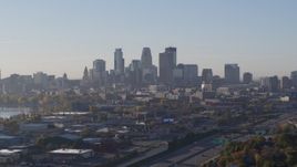 5.7K aerial stock footage descending with view of the city's downtown skyline at sunrise in Downtown Minneapolis, Minnesota Aerial Stock Footage | DX0001_002097