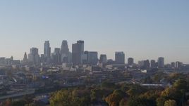 5.7K aerial stock footage ascend to reveal the city's downtown skyline at sunrise in Downtown Minneapolis, Minnesota Aerial Stock Footage | DX0001_002099