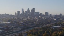 5.7K aerial stock footage slow descent with view of city's downtown skyline at sunrise in Downtown Minneapolis, Minnesota Aerial Stock Footage | DX0001_002101