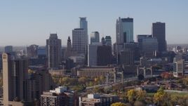 5.7K aerial stock footage of skyscrapers in city's skyline at sunrise in Downtown Minneapolis, Minnesota Aerial Stock Footage | DX0001_002103