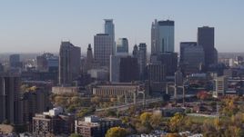 5.7K aerial stock footage of skyscrapers in city's skyline seen from condo complex at sunrise in Downtown Minneapolis, Minnesota Aerial Stock Footage | DX0001_002106