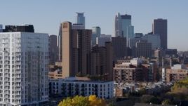 5.7K aerial stock footage flyby apartments to reveal condo complex and city's skyline at sunrise in Downtown Minneapolis, Minnesota Aerial Stock Footage | DX0001_002108