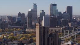 5.7K aerial stock footage flyby condo complex with view of city's skyline at sunrise in Downtown Minneapolis, Minnesota Aerial Stock Footage | DX0001_002110