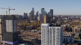 5.7K aerial stock footage of a view of the city's skyline seen from apartment building at sunrise in Downtown Minneapolis, Minnesota Aerial Stock Footage | DX0001_002114