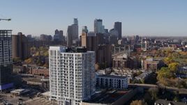 5.7K aerial stock footage of city's skyline and an apartment building at sunrise in Downtown Minneapolis, Minnesota Aerial Stock Footage | DX0001_002117