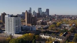 5.7K aerial stock footage of flyby apartment building at sunrise, condo complex and skyline in background in Downtown Minneapolis, Minnesota Aerial Stock Footage | DX0001_002119