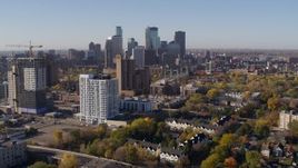 5.7K aerial stock footage descend with apartment complex in foreground and skyline in background in Downtown Minneapolis, Minnesota Aerial Stock Footage | DX0001_002121
